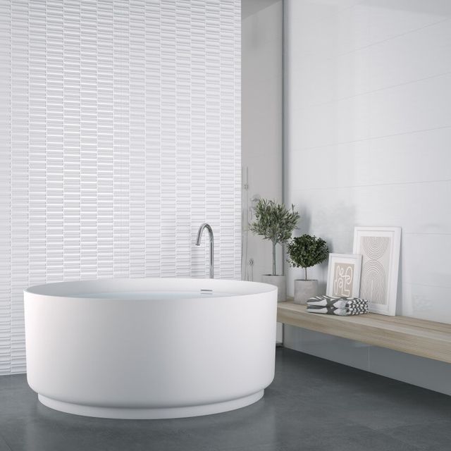 Azulejera Cerámica Cordobesa S.L. azulejo blanco brillo y suelo porcelánico efecto cemento serie montblanc (grespania)